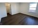 Bright bedroom featuring dark wood floors and a walk-in closet with natural light at 4301 Darius Lane # 28, Fuquay Varina, NC 27526