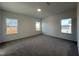 Neutral bedroom featuring plush carpet, three windows, and natural light at 4301 Darius Lane # 28, Fuquay Varina, NC 27526