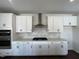 Gourmet kitchen featuring stainless steel appliances, granite countertops and decorative tile backsplash at 4301 Darius Lane # 28, Fuquay Varina, NC 27526