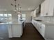 Well-lit kitchen featuring a large island with pendant lighting, and stainless steel appliances at 4301 Darius Lane # 28, Fuquay Varina, NC 27526