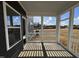 Cozy screened-in porch with white columns, offering an ideal outdoor living space at 4301 Darius Lane # 28, Fuquay Varina, NC 27526