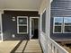 Covered porch with white railing, showcasing the home's attractive exterior features at 4301 Darius Lane # 28, Fuquay Varina, NC 27526