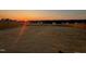 Expansive backyard with a wooden fence, offering privacy and a large space for outdoor activities at sunset at 45 Florentine Ct, Angier, NC 27501