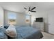 Sunlit bedroom with neutral walls and large windows offers plenty of natural light at 45 Florentine Ct, Angier, NC 27501