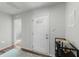 Bright entryway featuring a white door, light walls, and modern flooring at 45 Florentine Ct, Angier, NC 27501
