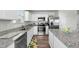 Modern kitchen with stainless steel appliances, granite countertops, and ample cabinet space at 45 Florentine Ct, Angier, NC 27501