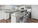 Modern kitchen with white cabinets, granite countertops, and stainless steel appliances at 45 Florentine Ct, Angier, NC 27501