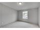 An empty bedroom with neutral carpet, light gray walls, and a window at 453 Deer Vw, Sanford, NC 27332