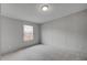 An empty bedroom with neutral carpet, light gray walls, and a window at 453 Deer Vw, Sanford, NC 27332