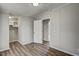Bright bedroom featuring modern flooring, a door, and a closet for storage at 453 Deer Vw, Sanford, NC 27332