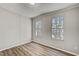 Bright bedroom featuring two windows offering natural light and modern flooring at 453 Deer Vw, Sanford, NC 27332
