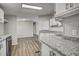 Modern kitchen with granite countertops, sleek stainless steel appliances, and ample cabinet space at 453 Deer Vw, Sanford, NC 27332