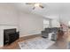 Spacious living room and dining area, featuring a fireplace and stairs to the second floor at 47 Highmeadow Ln, Clayton, NC 27520