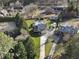 Aerial view of a home featuring a swimming pool, driveway, and well-manicured lawns at 4709 Wyndchase Ct, Fuquay Varina, NC 27526