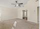 Large bedroom with neutral carpet, vaulted ceiling, and an adjoining living space at 4709 Wyndchase Ct, Fuquay Varina, NC 27526
