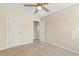 Bedroom featuring neutral carpet, ceiling fan, and an ensuite bathroom at 4709 Wyndchase Ct, Fuquay Varina, NC 27526