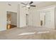 Spacious main bedroom with a ceiling fan and neutral carpeting throughout at 4709 Wyndchase Ct, Fuquay Varina, NC 27526