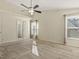 Bedroom featuring neutral carpet, ceiling fan, and natural light from two windows at 4709 Wyndchase Ct, Fuquay Varina, NC 27526