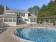 Backyard featuring an in-ground pool, spacious deck, screened porch, and a shaded gazebo at 4709 Wyndchase Ct, Fuquay Varina, NC 27526