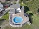Aerial view showcasing a pristine above ground swimming pool with a spacious surrounding deck at 4709 Wyndchase Ct, Fuquay Varina, NC 27526