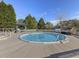 Inviting in-ground pool surrounded by an expansive wooden deck and lush landscaping at 4709 Wyndchase Ct, Fuquay Varina, NC 27526