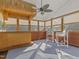 Charming sunroom with a bamboo bar, tropical decor, and comfortable seating at 4709 Wyndchase Ct, Fuquay Varina, NC 27526