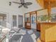 Inviting sunroom with a bamboo bar, indoor/outdoor carpet, and access to the patio at 4709 Wyndchase Ct, Fuquay Varina, NC 27526