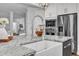 Beautiful kitchen with white farmhouse sink, granite countertops, and stainless steel appliances at 4800 Salem Ridge Rd, Holly Springs, NC 27540