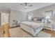 Nicely appointed main bedroom with a ceiling fan, plush rug, and modern furniture at 4800 Salem Ridge Rd, Holly Springs, NC 27540