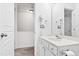 Bright bathroom features white vanity, ample lighting, and neutral walls at 5117 Singing Wind Dr, Raleigh, NC 27612