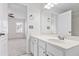 Bright white bathroom featuring a spacious vanity and large mirror at 5117 Singing Wind Dr, Raleigh, NC 27612