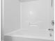 Bright bathroom bathtub featuring clean white walls and chrome hardware at 5117 Singing Wind Dr, Raleigh, NC 27612
