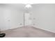 Bright bedroom featuring neutral walls and carpeting, ceiling fan and ample natural light at 5117 Singing Wind Dr, Raleigh, NC 27612