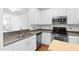Well-equipped kitchen featuring stainless steel appliances and ample counter space at 5117 Singing Wind Dr, Raleigh, NC 27612
