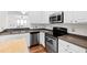Modern kitchen with stainless steel appliances and a functional layout at 5117 Singing Wind Dr, Raleigh, NC 27612