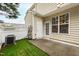 Private outdoor patio with artificial turf and white privacy fence at 5117 Singing Wind Dr, Raleigh, NC 27612