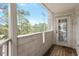 Balcony with wooden floors and white wood railing, providing outdoor living at 600 Audubon Lake Dr # 5A32, Durham, NC 27713