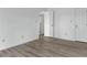 Bedroom with neutral paint, light flooring, and two large closets at 600 Audubon Lake Dr # 5A32, Durham, NC 27713
