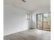 Bedroom with ample natural light and sliding glass door to exterior balcony at 600 Audubon Lake Dr # 5A32, Durham, NC 27713
