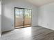 Bedroom with sliding doors to the balcony and views of the lush greenery at 600 Audubon Lake Dr # 5A32, Durham, NC 27713