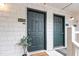 Close-up of condo front door with welcome mat and green paint at 600 Audubon Lake Dr # 5A32, Durham, NC 27713