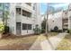 A condo building with a walkway, screened porch and well maintained landscaping at 600 Audubon Lake Dr # 5A32, Durham, NC 27713