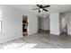 Open living room with wood floors and easy access to the kitchen and a laundry room at 600 Audubon Lake Dr # 5A32, Durham, NC 27713