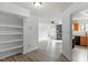 Bright living room with a fireplace, ceiling fan, hardwood floors, and open access to the kitchen at 600 Audubon Lake Dr # 5A32, Durham, NC 27713