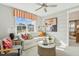 Cozy living room with a plush white sofa, stylish decor, and natural light from a large window at 601 Callan View Ave, Wake Forest, NC 27587