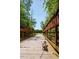 Dog-friendly walking trail with a small wooden bridge through the trees at 601 Callan View Ave, Wake Forest, NC 27587