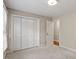 Cozy bedroom with closet, light walls, and a window for natural light at 6025 Spring Valley Dr, Raleigh, NC 27616