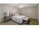 Primary bedroom featuring carpeted floors and a cushioned bench at 6025 Spring Valley Dr, Raleigh, NC 27616