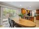 Cozy dining area adjacent to the kitchen with a sliding glass door to the backyard at 6025 Spring Valley Dr, Raleigh, NC 27616