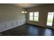 Cozy dining room features wainscoting detail, wood floors, and natural light at 622 Ravensworth Dr, Garner, NC 27529